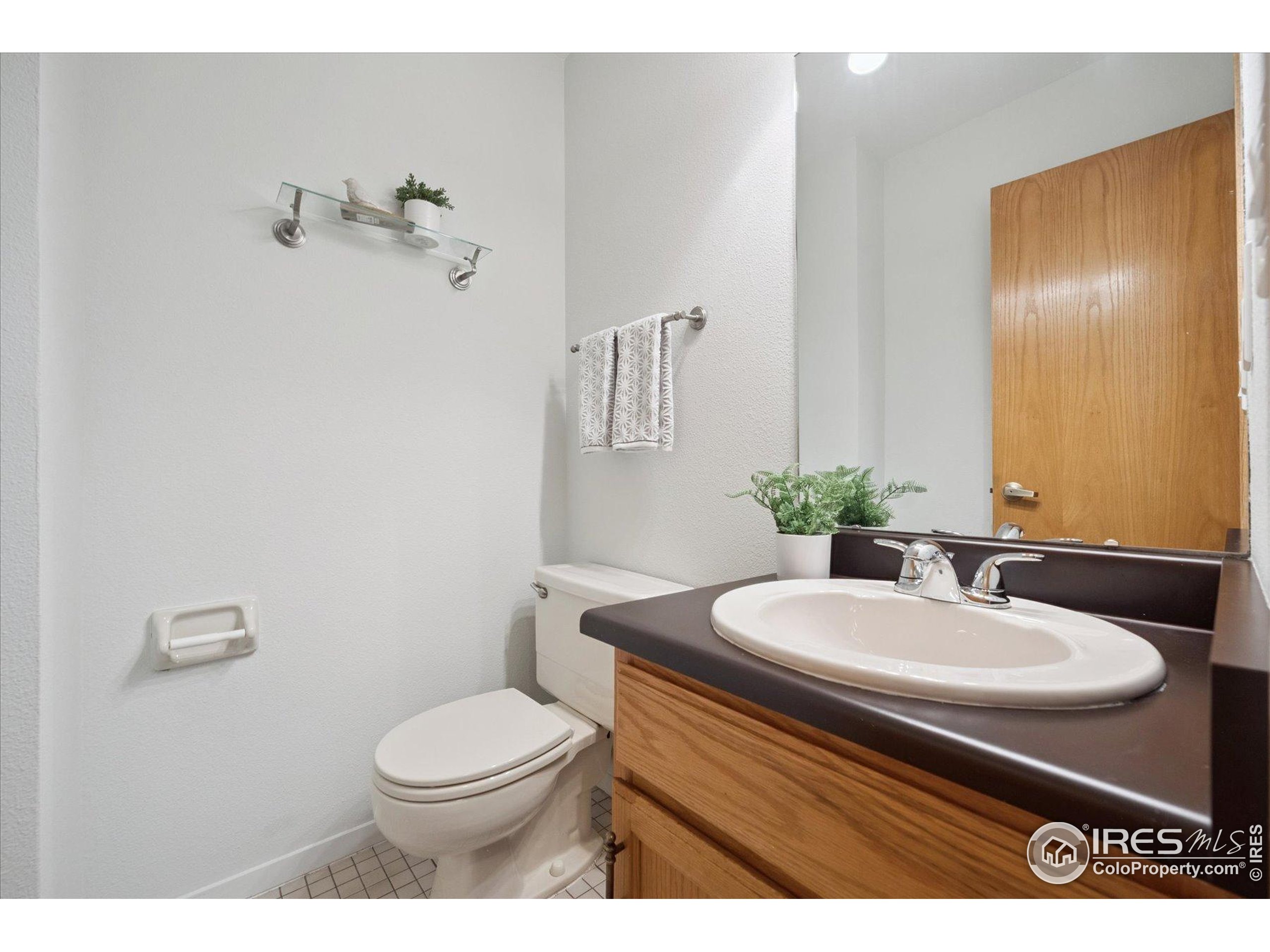 3330 34th Street Boulder, CO 80301 - Photo 16 of 32 a bathroom with a sink toilet and a mirror