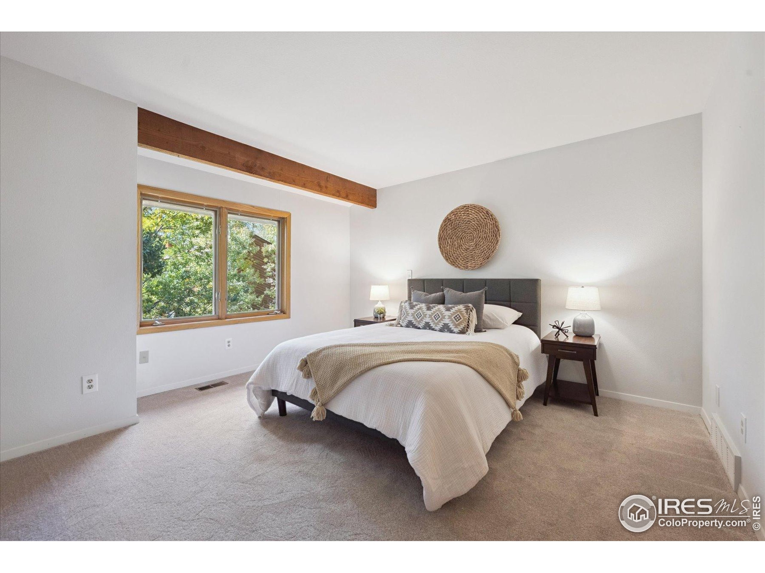 3330 34th Street Boulder, CO 80301 - Photo 17 of 32 a bedroom with a bed and window