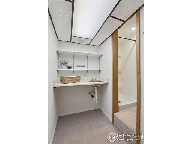 a room with cabinets and a sink