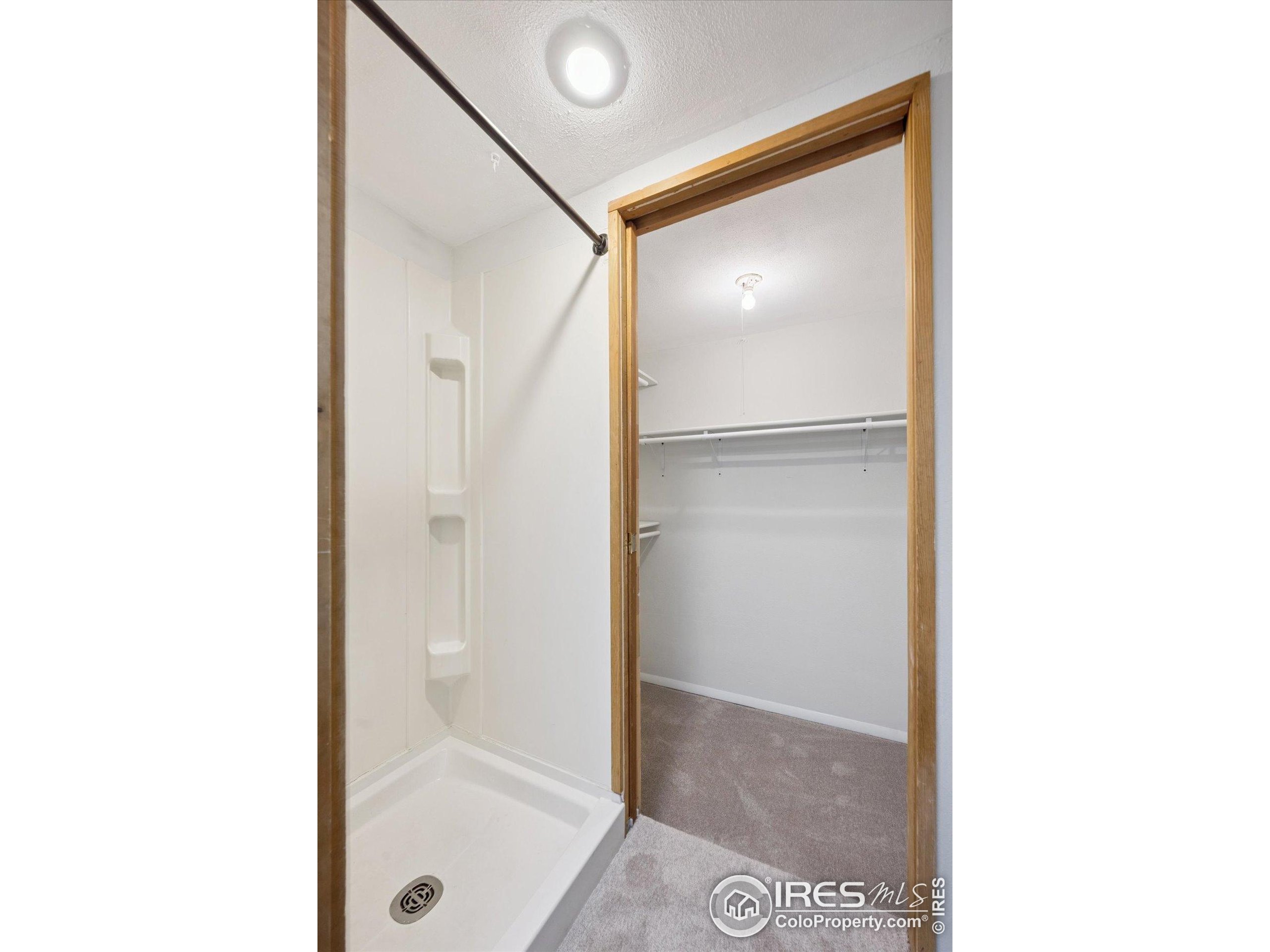 3330 34th Street Boulder, CO 80301 - Photo 27 of 32 a bathroom with a glass shower door
