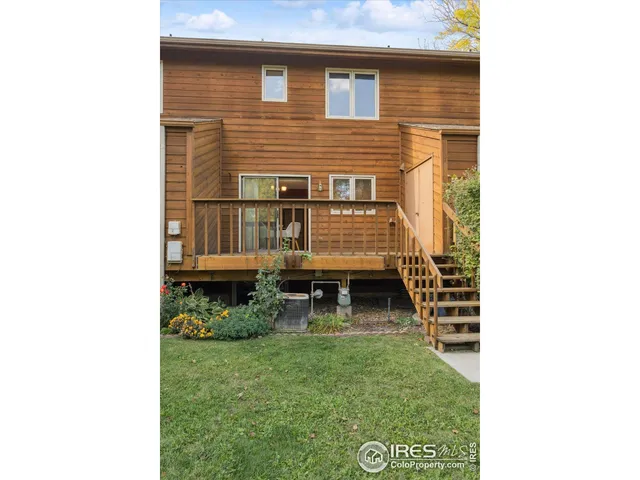 a view of backyard with a chair and table