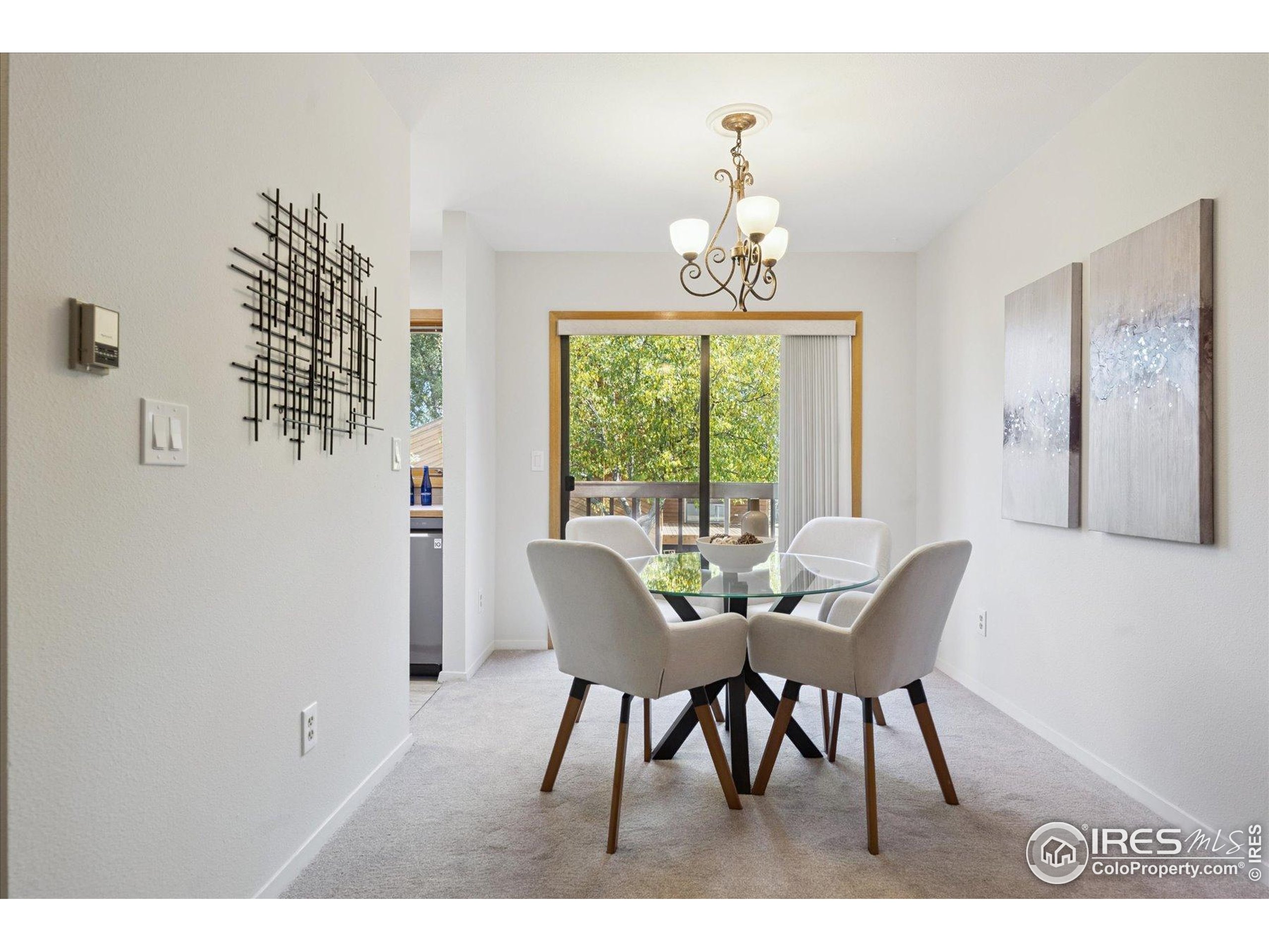3330 34th Street Boulder, CO 80301 - Photo 10 of 32 a view of a dining room with furniture and chandelier