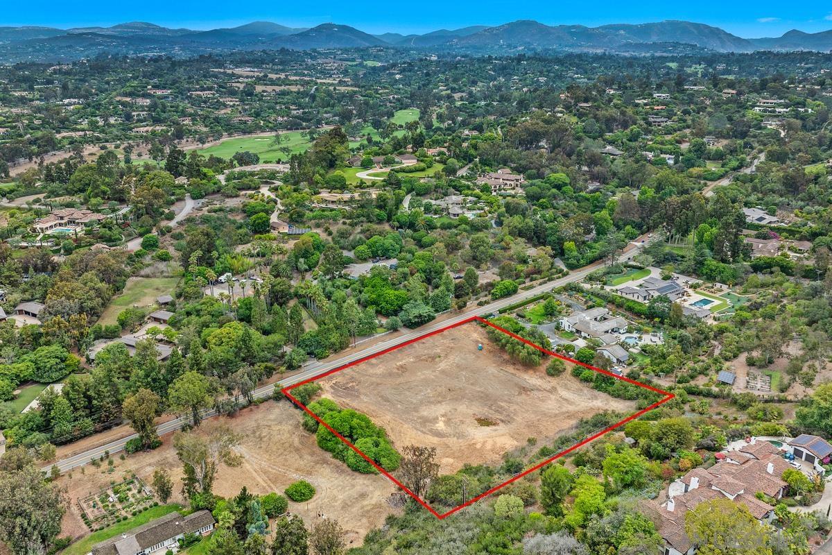 4919 El Secreto Rancho Santa Fe, CA 92067 - Photo 10 of 13 an aerial view of a house with a yard and mountain view in back