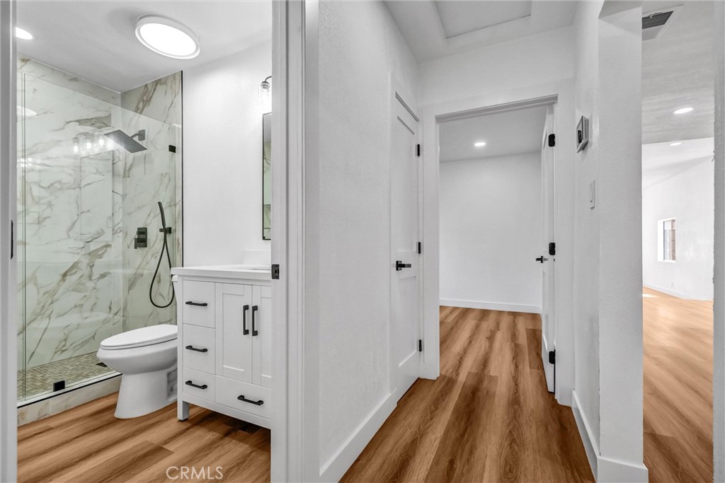 1200 South Castlegate Avenue Compton, CA 90221 - Photo 17 of 39 Hallway looking into 1 of the 2 bedrooms on the bottom floor