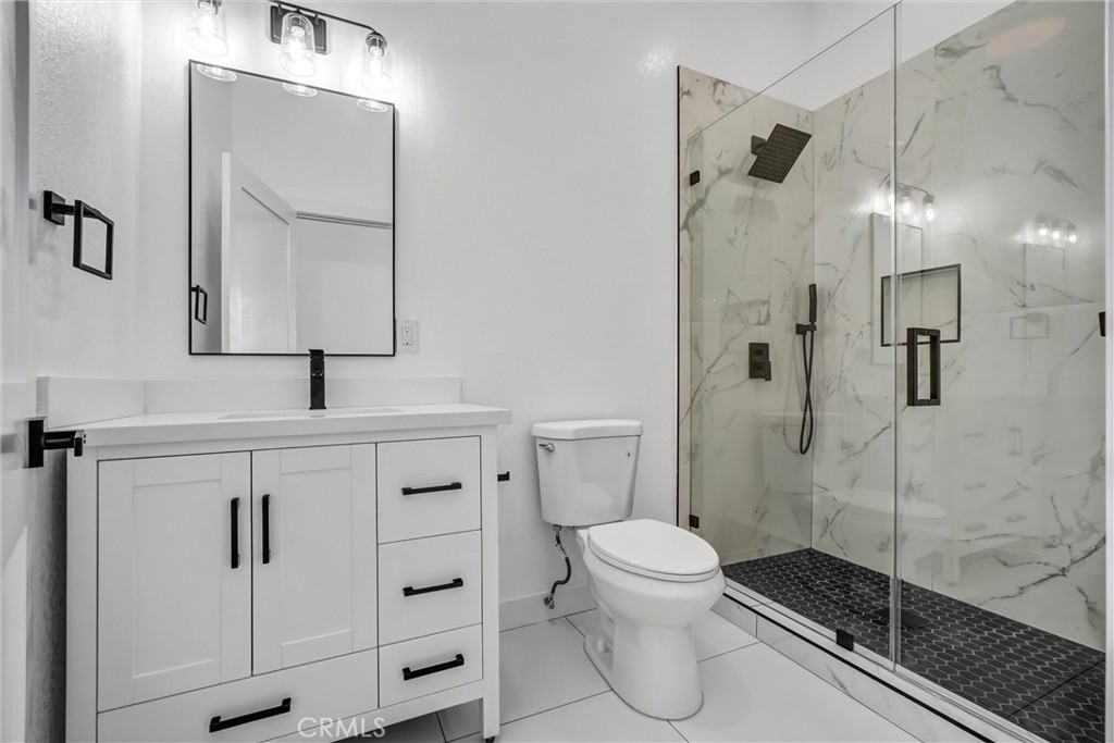 1200 South Castlegate Avenue Compton, CA 90221 - Photo 23 of 39 Top floor bathroom located on top of stairs