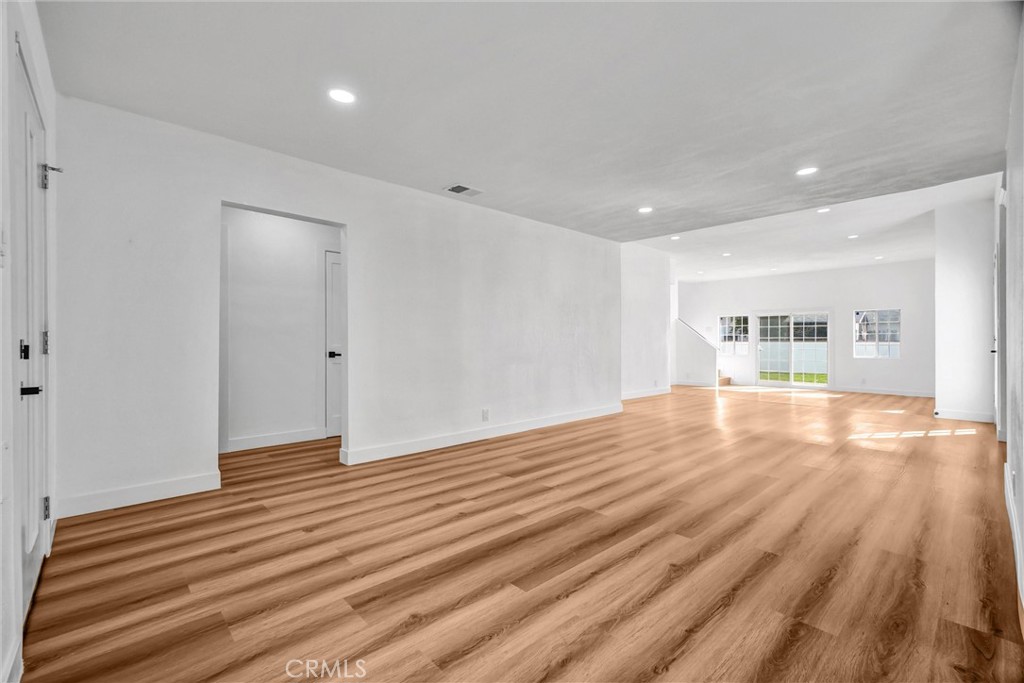 1200 South Castlegate Avenue Compton, CA 90221 - Photo 7 of 39 Living room facing hallway and backdoor