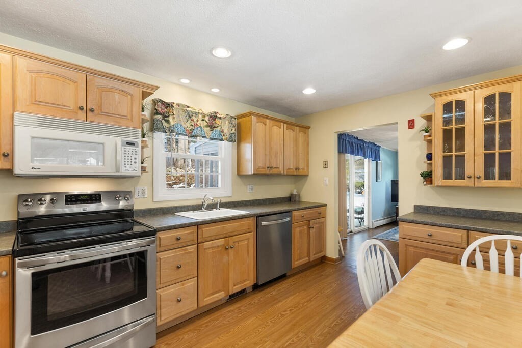 23 Walker Road Beverly, MA 01915 - Photo 13 of 33 a kitchen with stainless steel appliances granite countertop a stove and a sink
