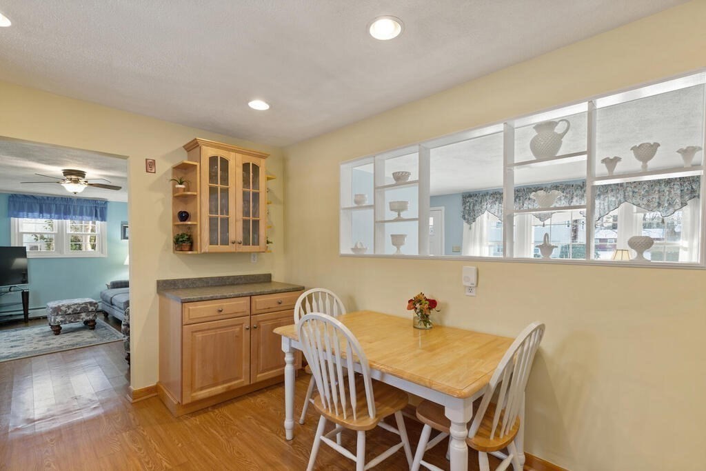 23 Walker Road Beverly, MA 01915 - Photo 14 of 33 a view of a dining room with furniture and wooden floor