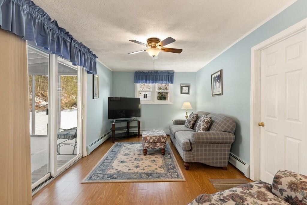 23 Walker Road Beverly, MA 01915 - Photo 17 of 33 a living room with furniture and a rug