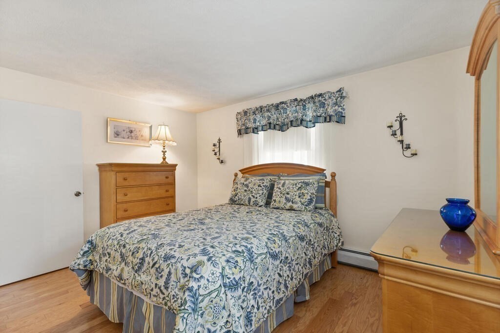 23 Walker Road Beverly, MA 01915 - Photo 21 of 33 a bedroom with a bed and a dresser