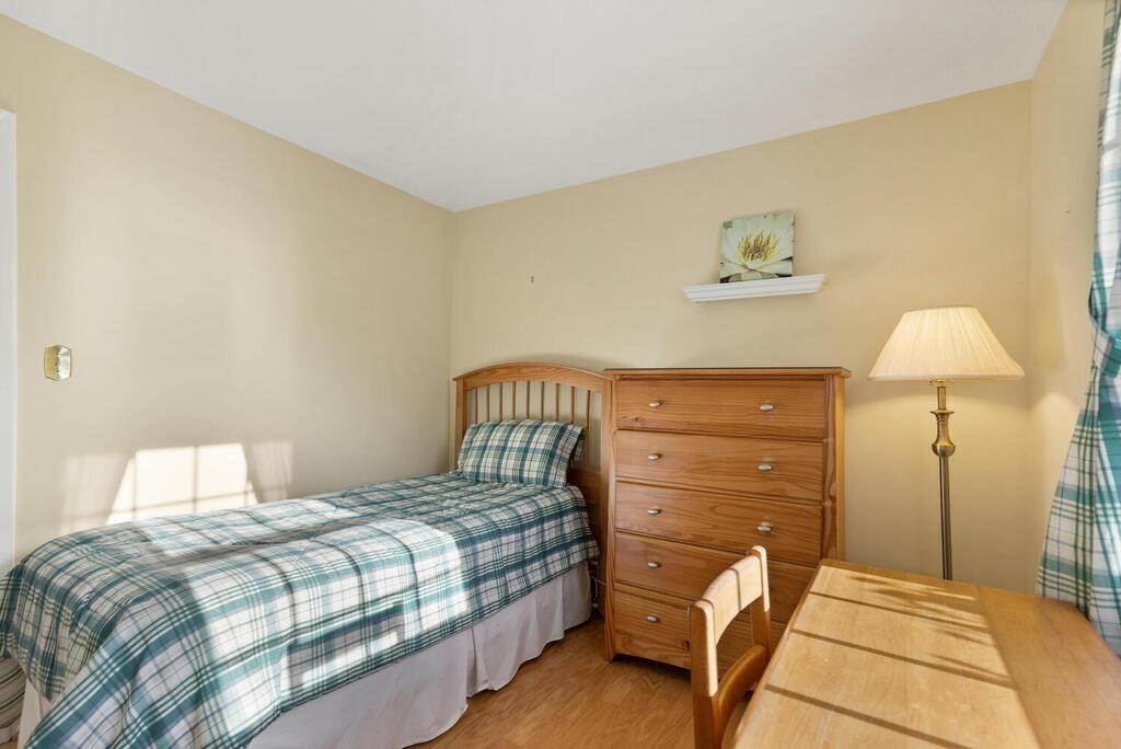 23 Walker Road Beverly, MA 01915 - Photo 26 of 33 a bedroom with a bed and a night stand