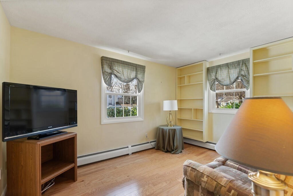 23 Walker Road Beverly, MA 01915 - Photo 28 of 33 a room with furniture and flat screen tv