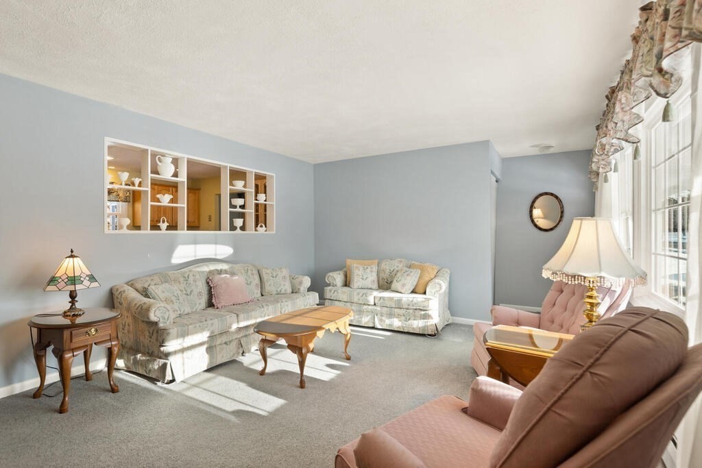 23 Walker Road Beverly, MA 01915 - Photo 7 of 33 a living room with furniture and a large window