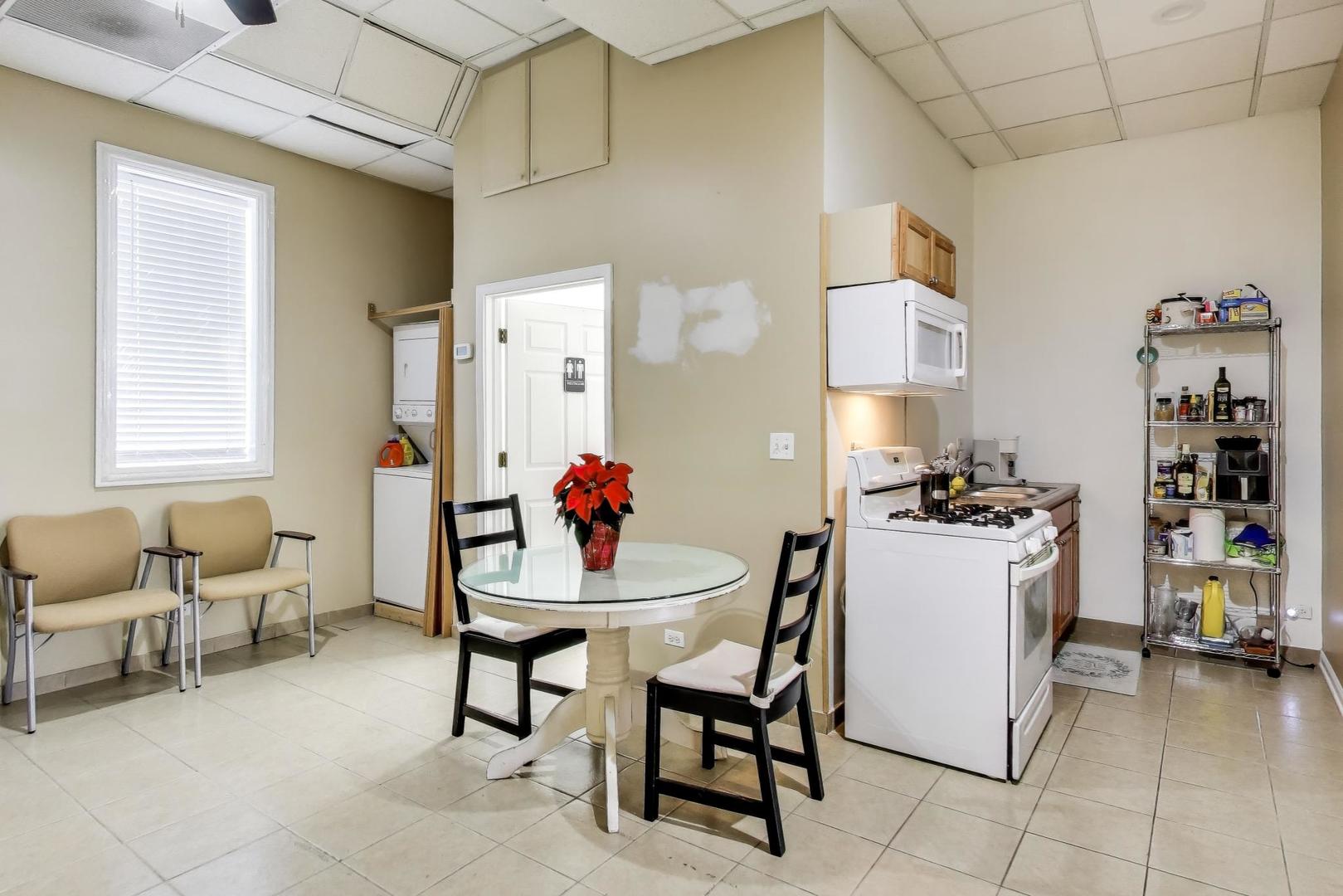4346 North Pulaski Road, Unit C Chicago, IL 60641 - Photo 8 of 20 a view of a dining room with furniture and a kitchen area