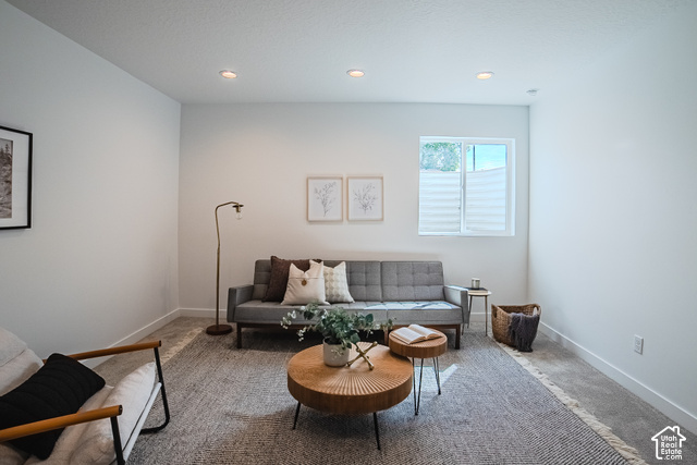 342 Perrine Drive Midvale, UT 84047 - Photo 32 of 37 Recessed ceiling lighting illuminates the space, featuring white walls, a single window with pleated shades, and carpeted flooring
