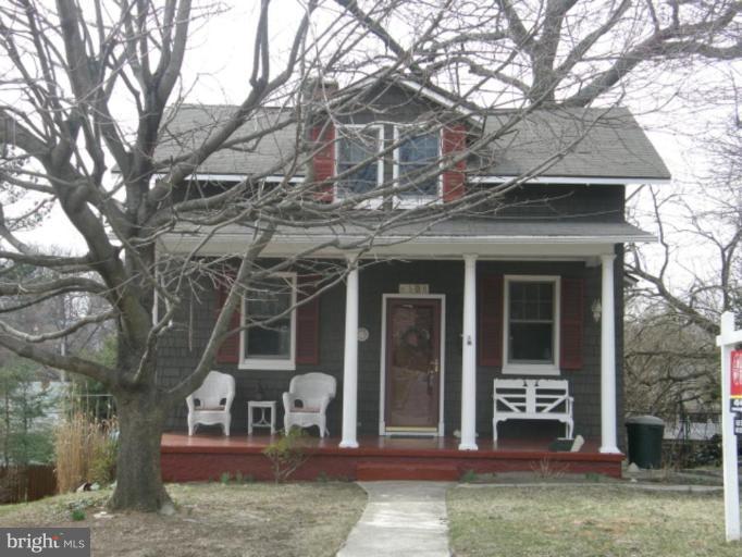 6508 Banbury Road Baltimore, MD 21239 - Photo 1 of 26 a front view of a house with garden