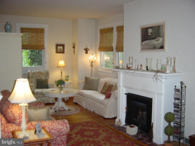 6508 Banbury Road Baltimore, MD 21239 - Photo 2 of 26 a living room with furniture and a fireplace