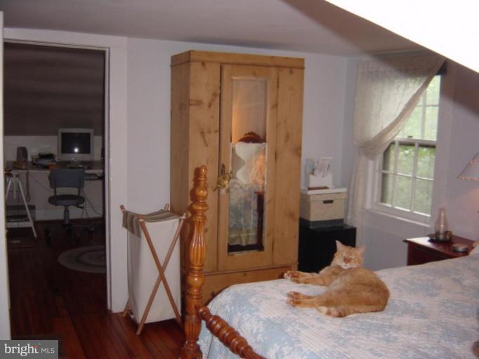 6508 Banbury Road Baltimore, MD 21239 - Photo 12 of 26 a bed room with a bed and a window