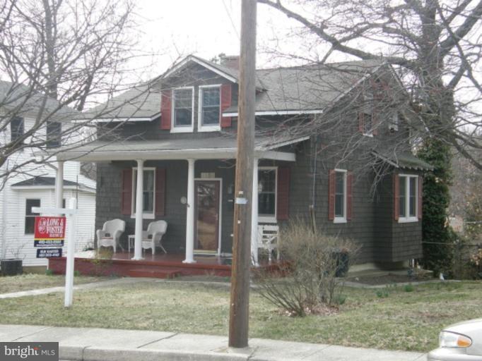 6508 Banbury Road Baltimore, MD 21239 - Photo 17 of 26 a front view of a house with garden