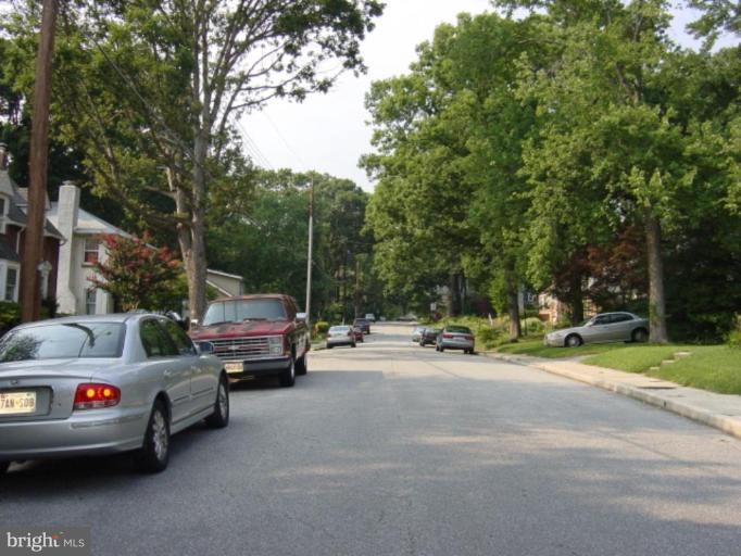 6508 Banbury Road Baltimore, MD 21239 - Photo 21 of 26 a view of car parked on the side of a street