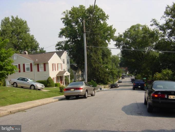 6508 Banbury Road Baltimore, MD 21239 - Photo 22 of 26 a view of a city street with cars