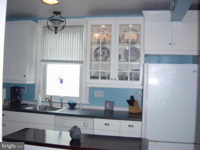6508 Banbury Road Baltimore, MD 21239 - Photo 8 of 26 a kitchen with stainless steel appliances a sink and cabinets