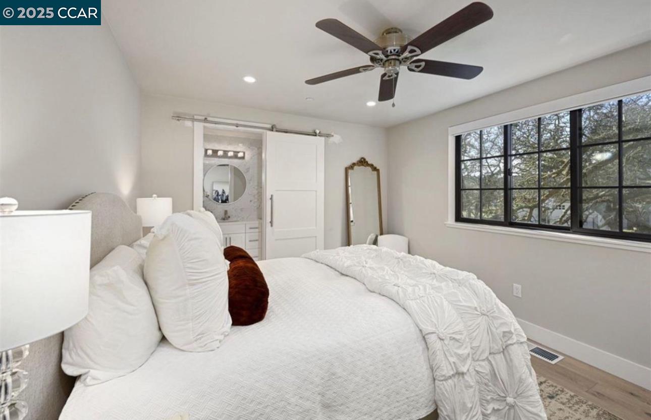 Stonegate Alamo, CA 94507 - Photo 5 of 8 a bedroom with a bed and a large window