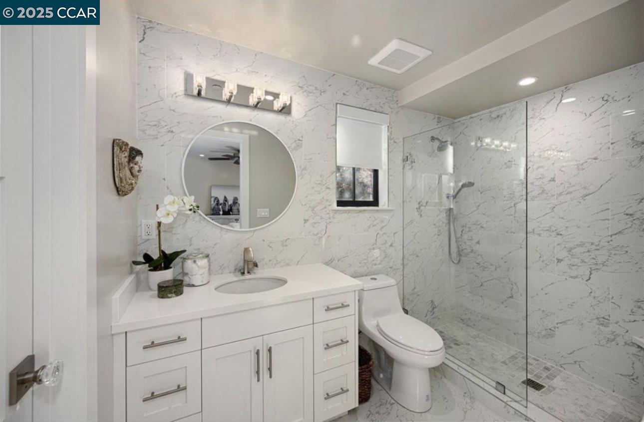 Stonegate Alamo, CA 94507 - Photo 6 of 8 a bathroom with a toilet sink and shower