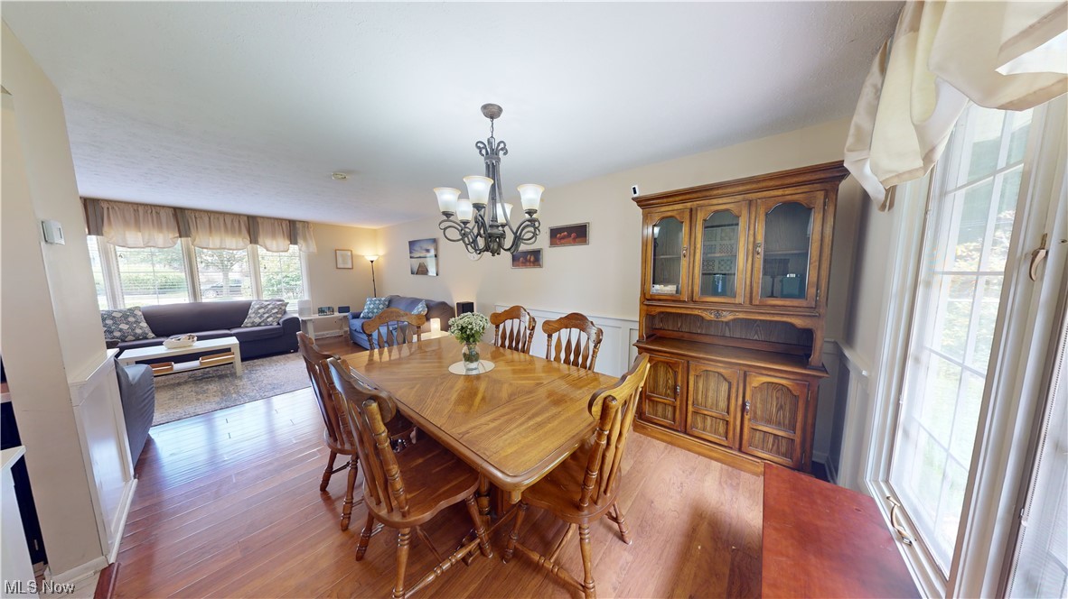 1071 Roland Road Lyndhurst, OH 44124 - Photo 7 of 30 Dining space featuring a notable chandelier and light hardwood flooring