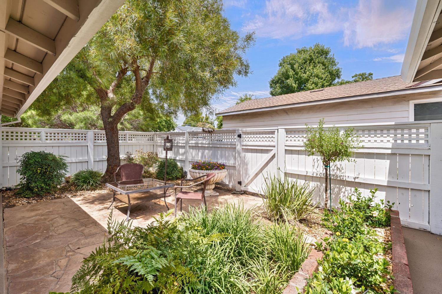 5422 Earnell Street Carmichael, CA 95608 - Photo 7 of 39 a view of a patio with table and chairs and potted plants
