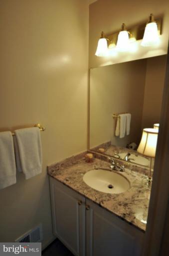 2004 Lakebreeze Way Reston, VA 20191 - Photo 11 of 30 THE MAIN LEVEL POWDER ROOM HAS BEEN UPDATED.