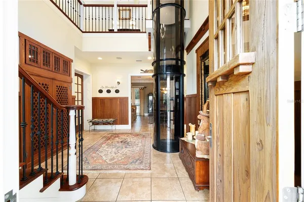 a living room with furniture ceiling fan and a rug