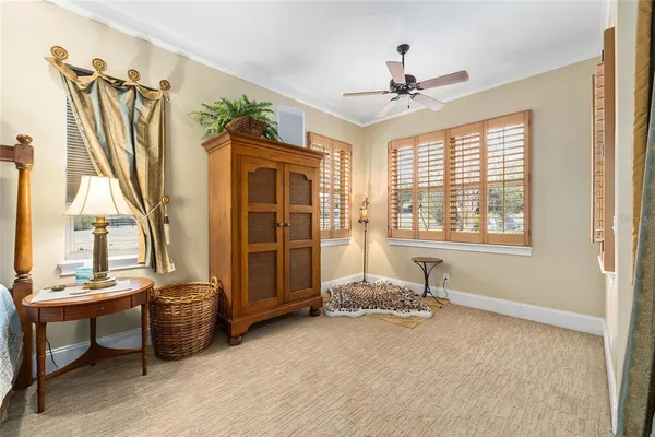 a kitchen with stainless steel appliances kitchen island granite countertop a table chairs and a view of living room
