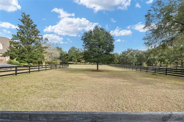a view of a backyard with sitting area