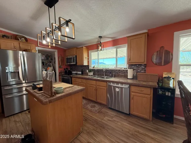 a bedroom with a bed and a television