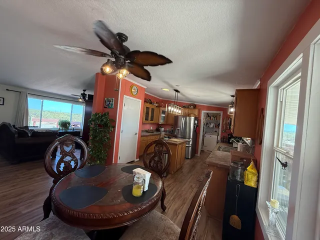 a bedroom with a bed couch and a window