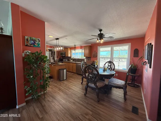 a bedroom with a bed and ceiling fan