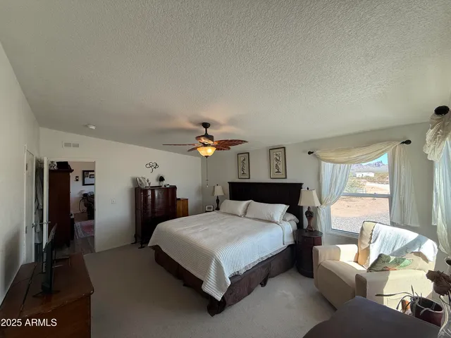 a bathroom with a double vanity sink a toilet and a mirror