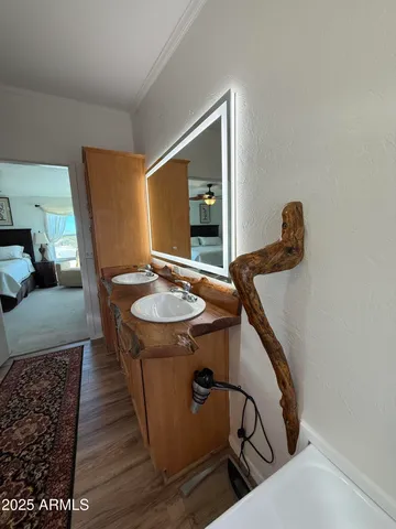 a dining room with furniture a rug and wooden floor