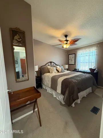 a patio with a table and chairs