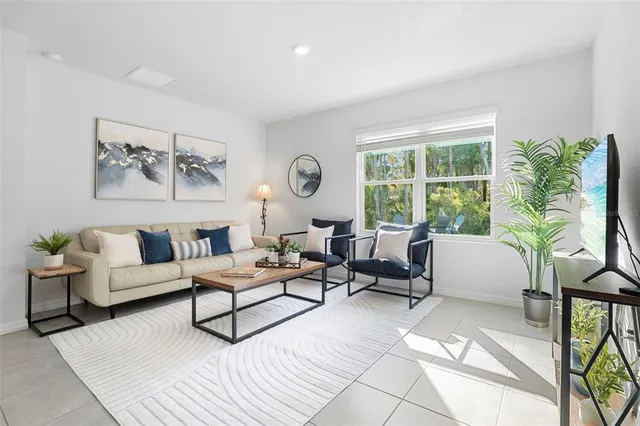 a living room with furniture and a table
