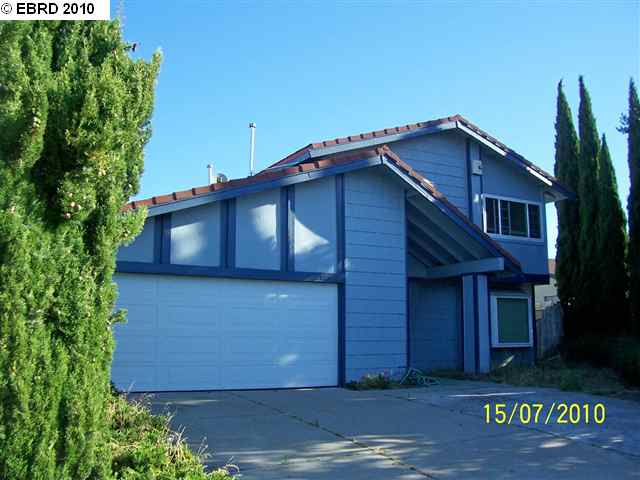 1053 Viewpointe Boulevard Rodeo, CA 94572 - Photo 1 of 1 a front view of a house with garden