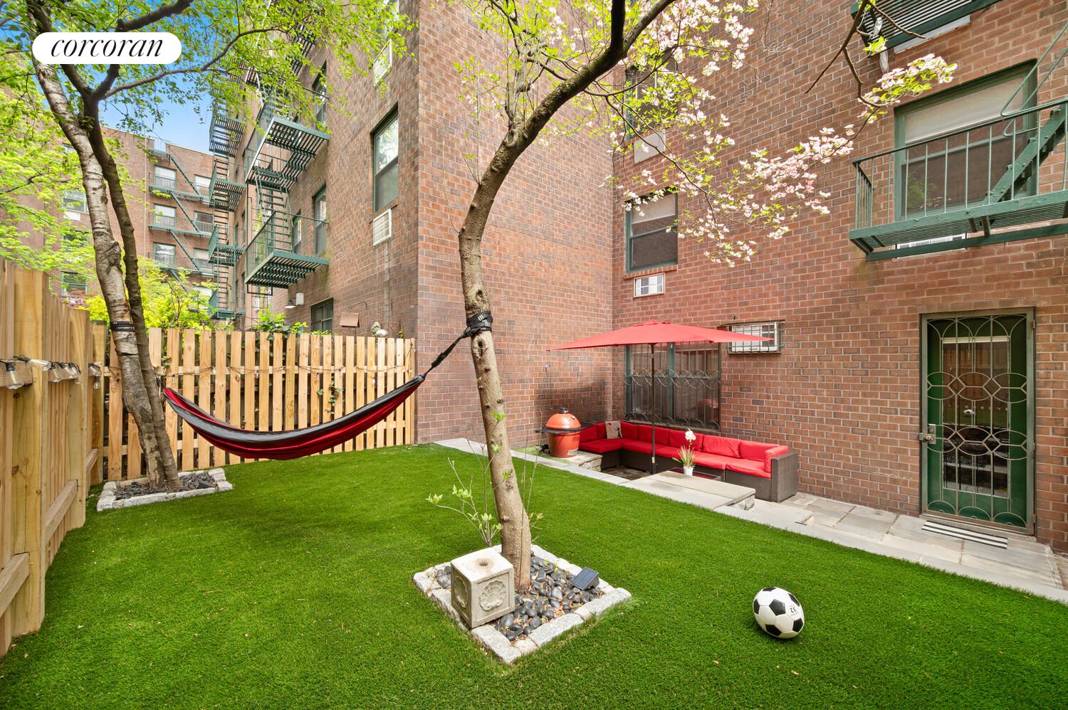 618 Washington Street, Unit GA Manhattan, NY 10014 - Photo 4 of 14 a garden with lots of swings and slides
