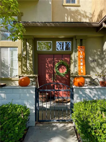 a view of a golf course with a house