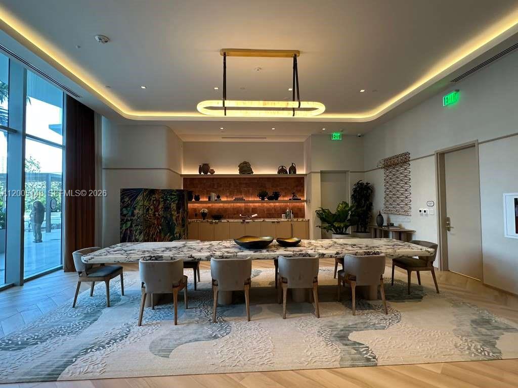 77 Southeast 5th Street, Unit 1815 Miami, FL 33131 - Photo 27 of 49 a view of a dining room with furniture