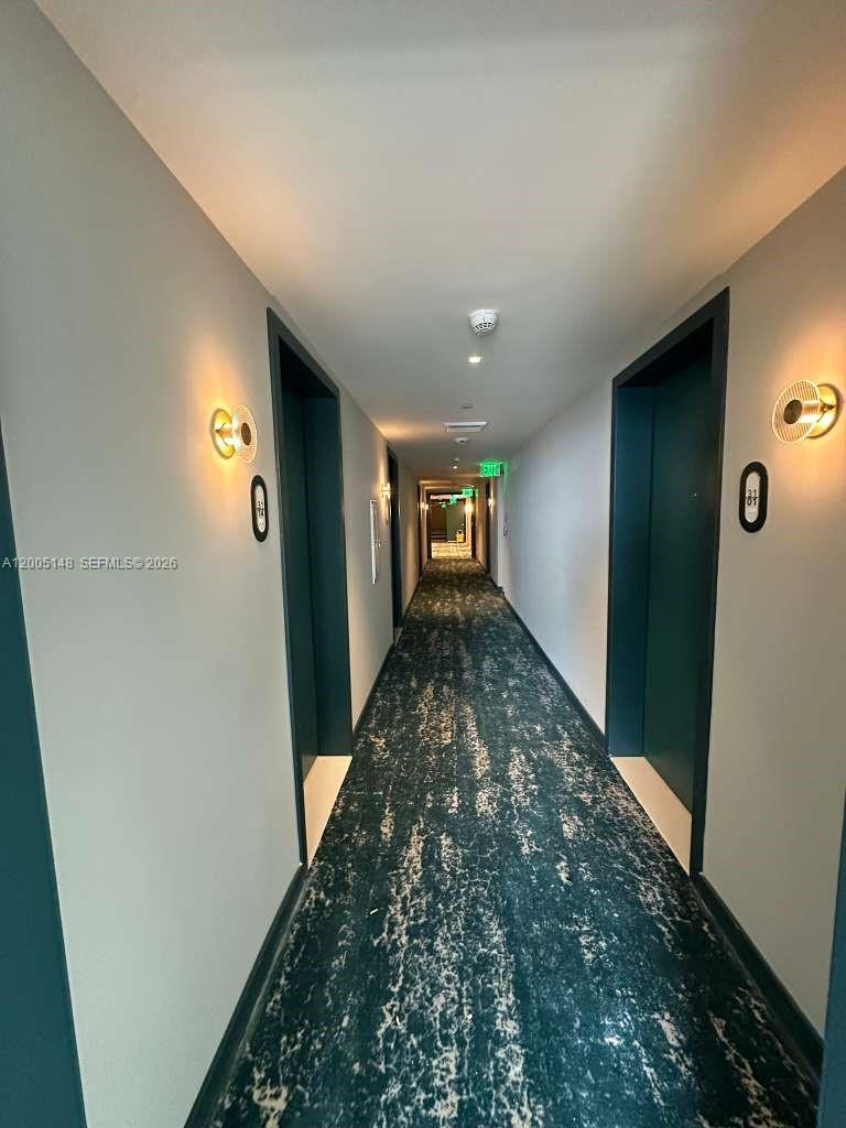 77 Southeast 5th Street, Unit 1815 Miami, FL 33131 - Photo 49 of 49 wooden floor in an empty room with a window