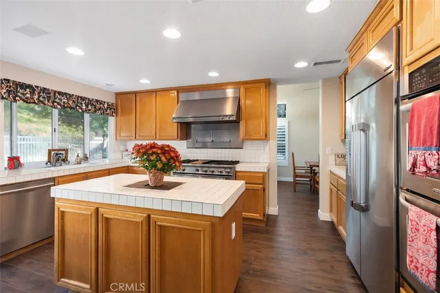 a kitchen with a sink appliances and cabinets