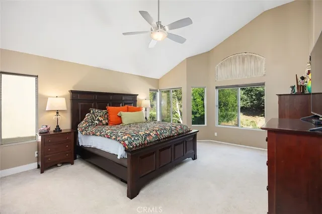 a bed sitting in a bedroom and a balcony