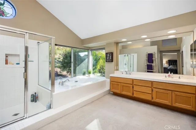 a bathroom with a bathtub and a shower