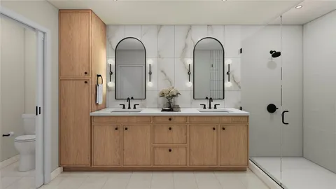 a bathroom with a double vanity sink and mirror with shower
